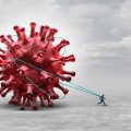 A graphic illustrating a red virus being dragged behind a model of a human being against a grey background. 